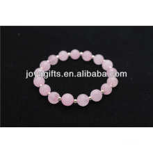Natural rose quartz beaded with small silver beads bracelet